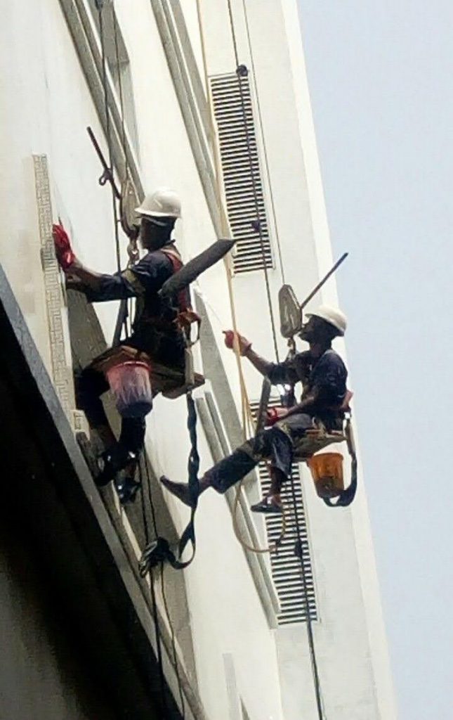 Kleenmates technicians on rope access, cleaning a building facade
